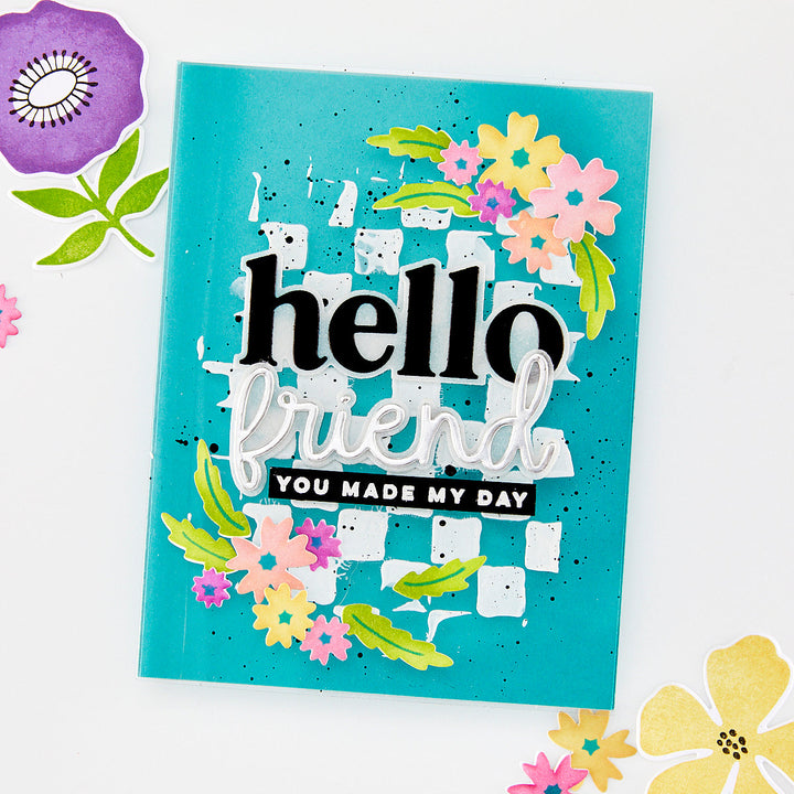 Turquoise card with floral designs and text on a white background
